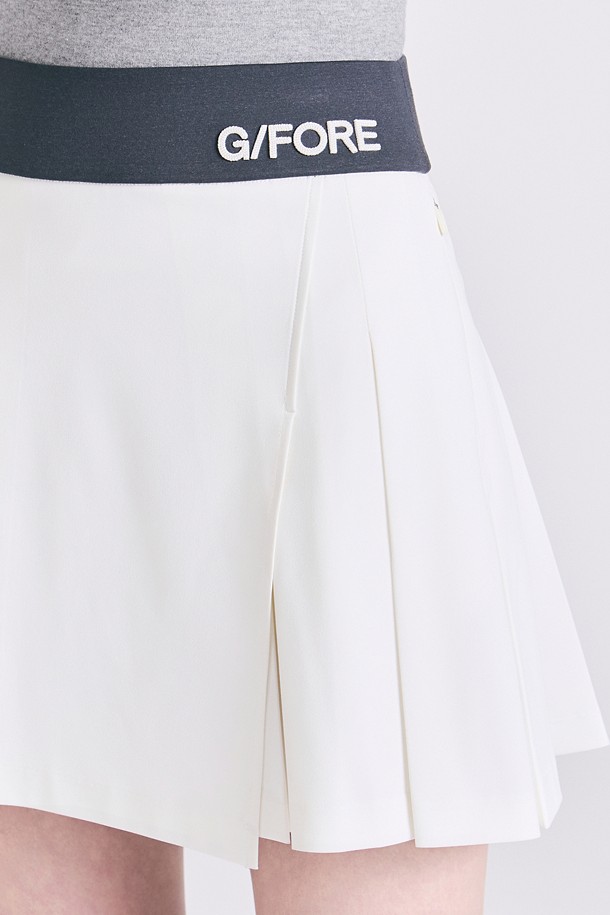 Chân váy golf nữ xếp ly phối viền logo màu ngà — ảnh 5