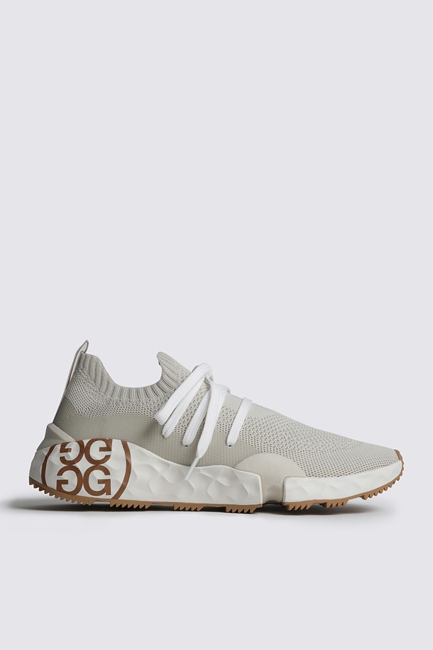 Giày golf nữ kiểu sneaker cổ chun màu be phối dây trắng đế họa tiết nâu G/FORE