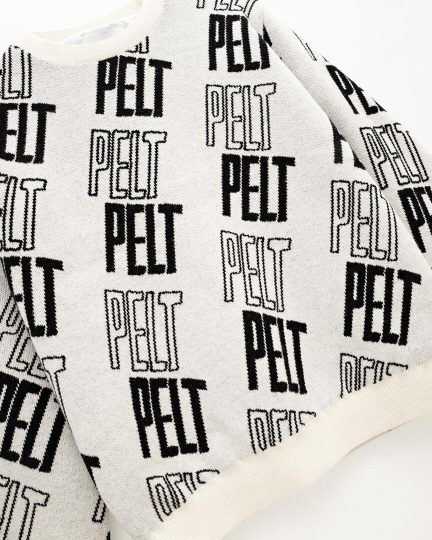 Áo knit golf nữ họa tiết chữ PELT màu ngà — ảnh 4